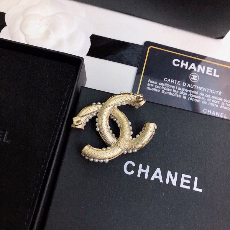 Ch**el brooches
